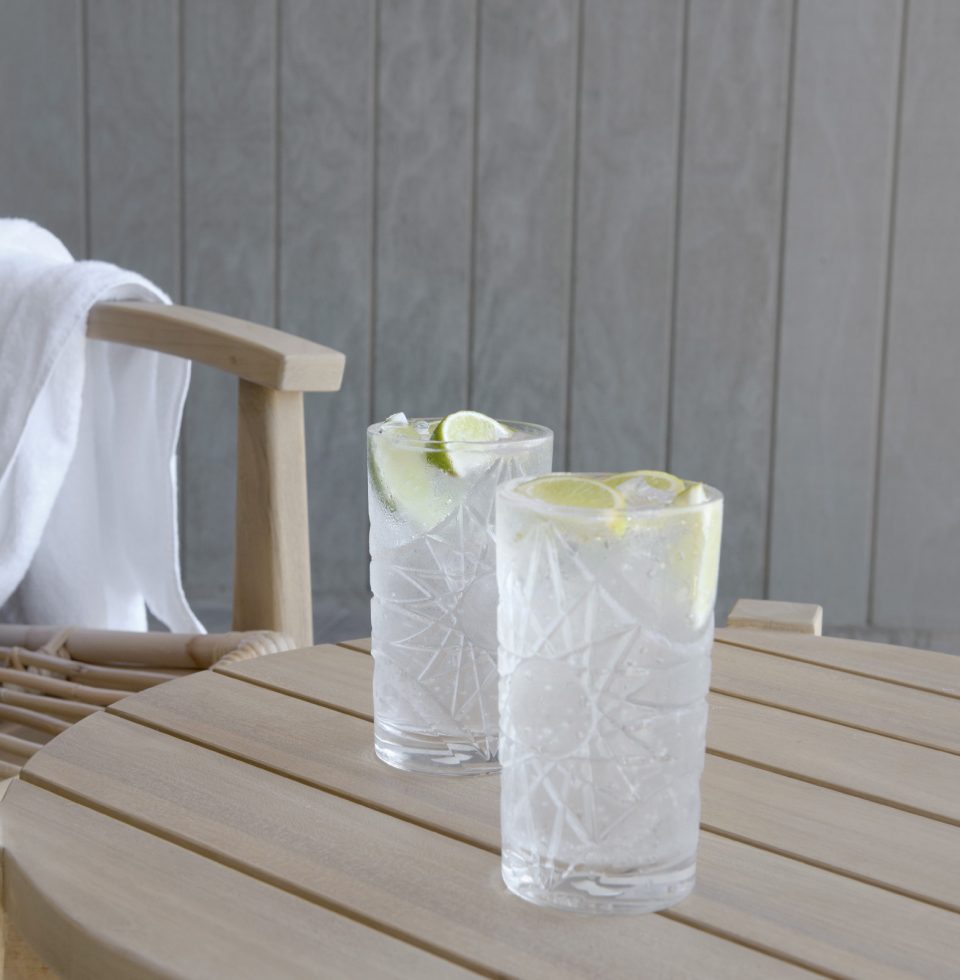 Two cocktails on an outdoor table