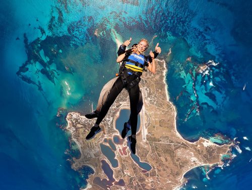 Two skydivers fall backwards over Rottnest Island