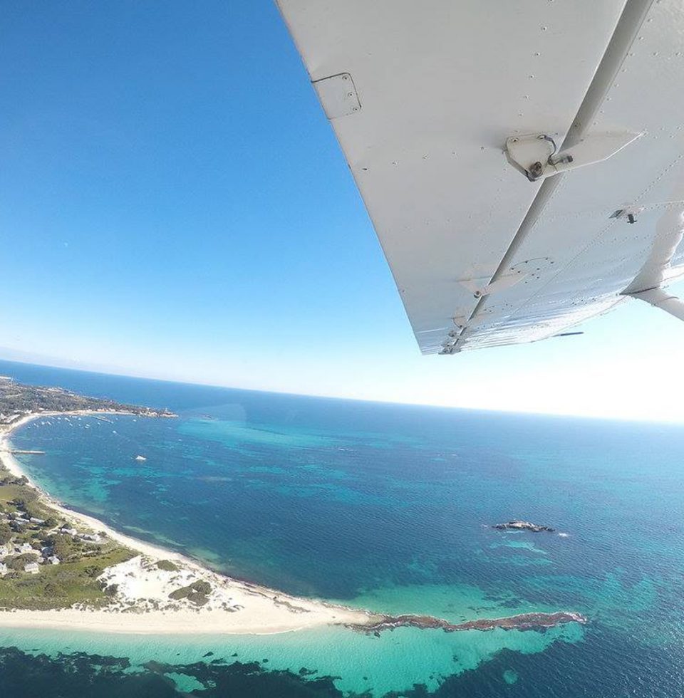 View of Rottnest coastline from a plane during a skydiving experience