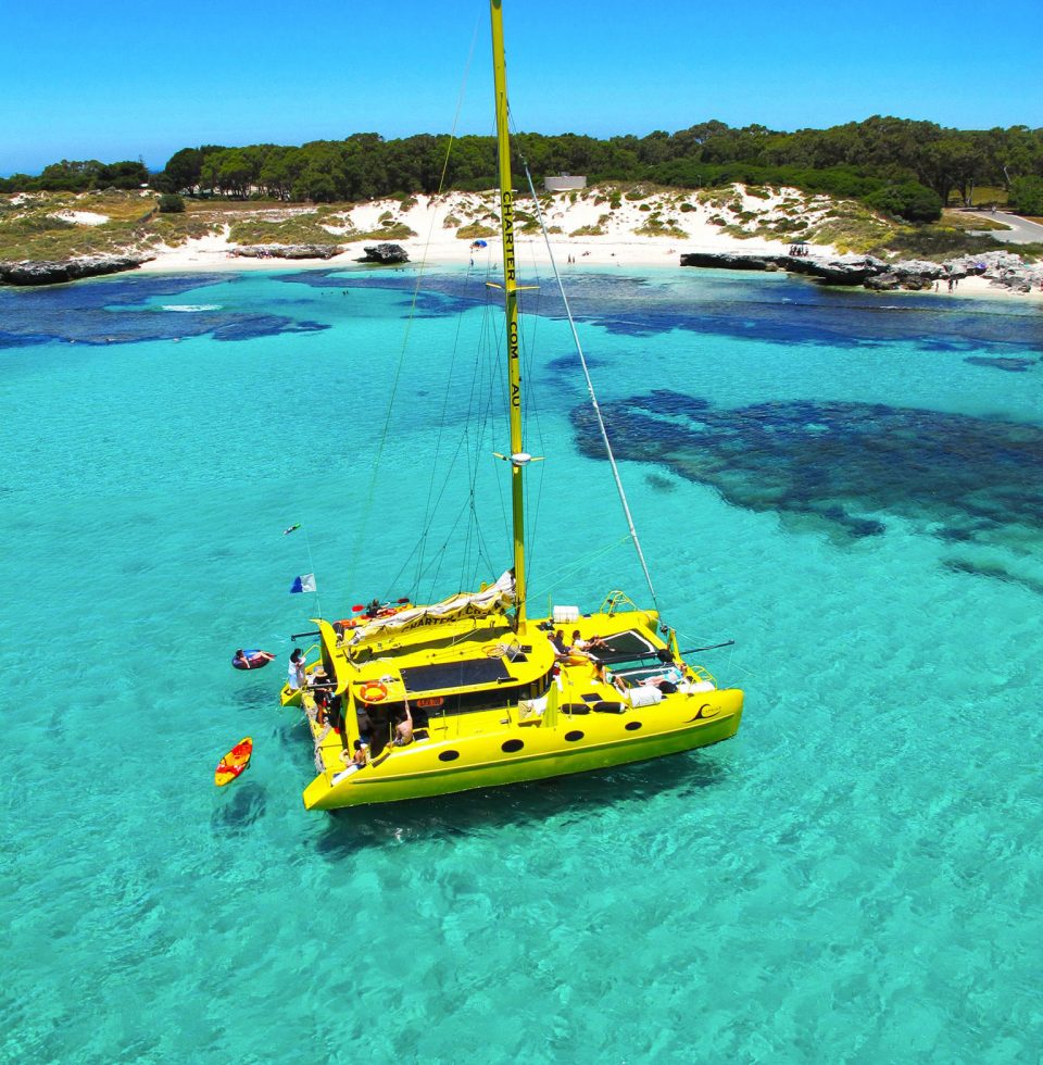 A boat floats near the shore in Rottnest Island