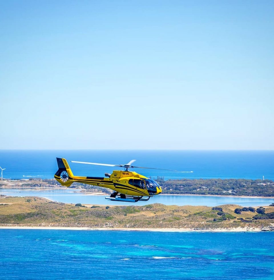 A helicopter flies over Rottnest Island