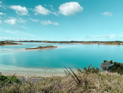 A salt lake on Rottnest Island, surrounded by bushland