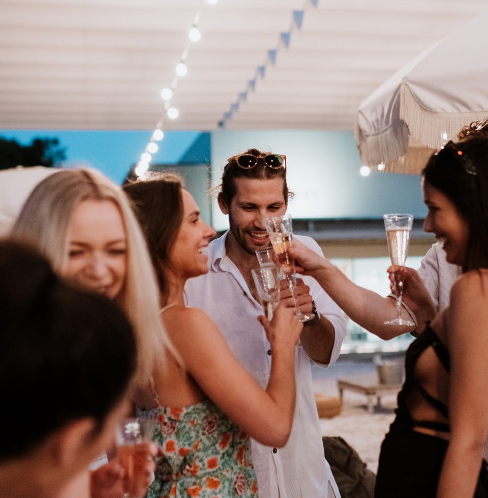 Hotel guests dance and chat in groups at Samphire Rottnest