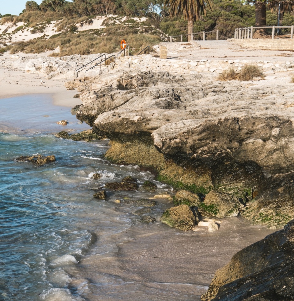 The Basin Beach has a rugged ledge and powder-soft sand